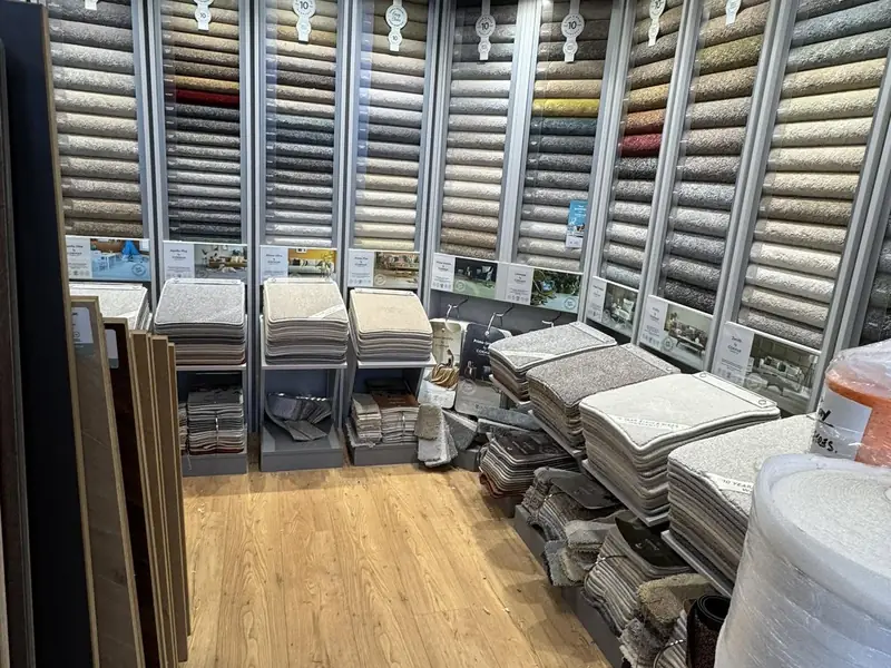 Carpet sample stands by the windows inside the Farrells showroom.