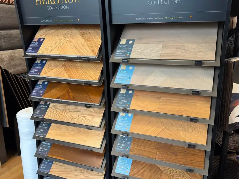 A display of wood-toned flooring samples in the Farrells showroom.